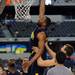 Michigan senior Eso Akunne is supported by freshman Mitch McGary as he dunks at the end of practice at Cowboys Stadium in Arlington, Texas on Thursday, March 28, 2013. Melanie Maxwell I AnnArbor.com